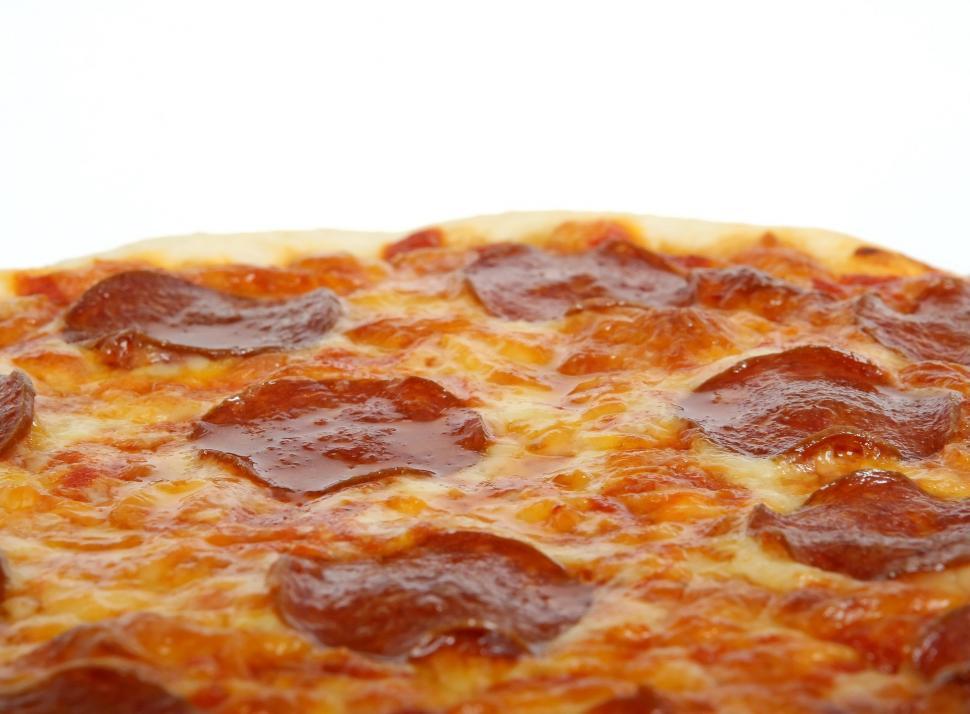 Free Image of Close Up of a Pepperoni Pizza on a White Background 