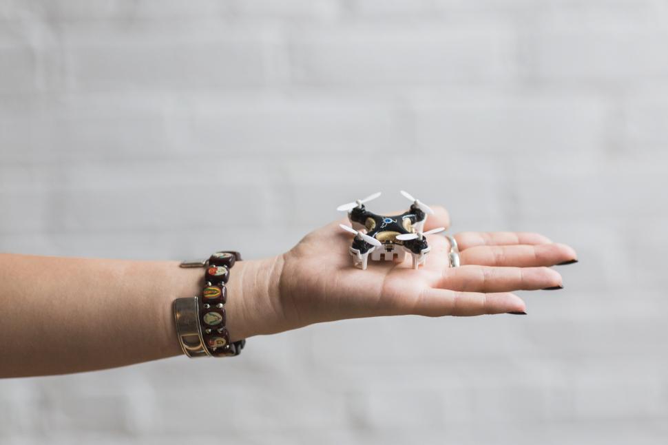Free Image of Woman Holding Drone 