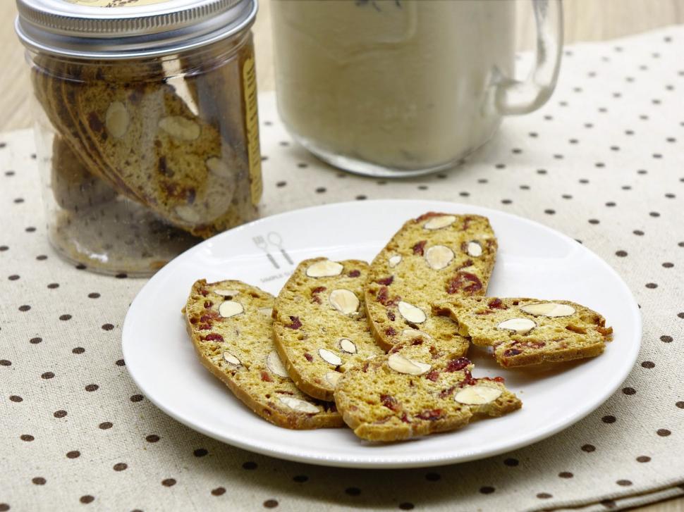 Free Image of White Plate With Cookies and Cookie Jar 