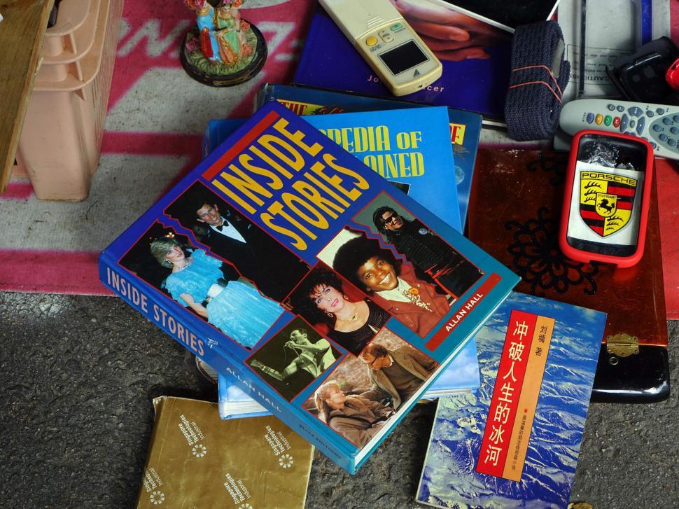 Free Image of A Pile of Books on Top of a Carpet 