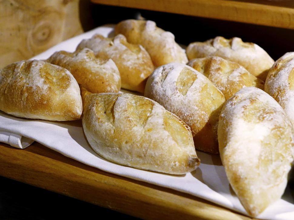 Free Image of Table Adorned With Assorted Pastries Covered in Powdered Sugar 