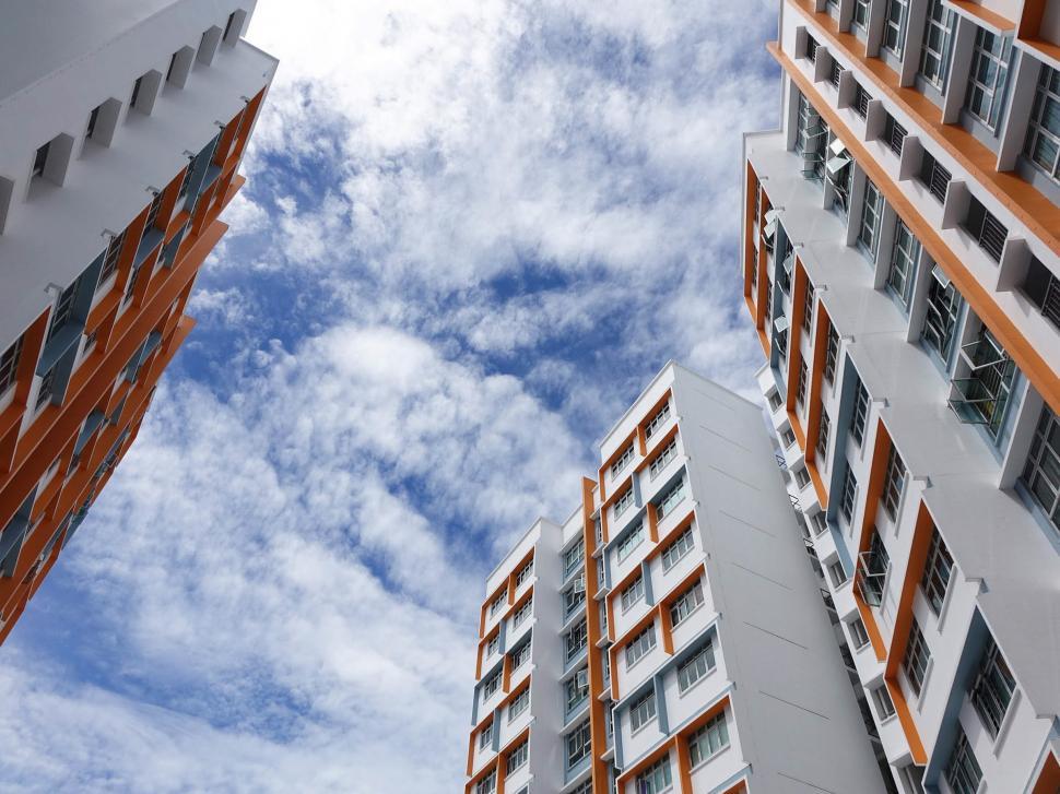 Free Image of Two Tall Buildings Adjacent to Each Other 