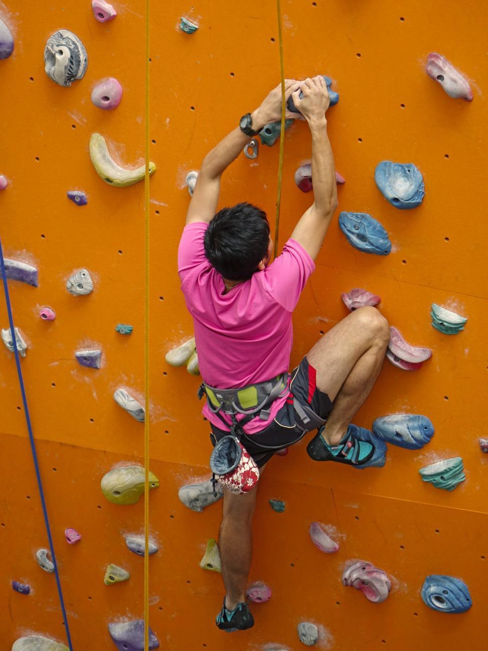 Free Image of Man Climbing Up Rock Wall 