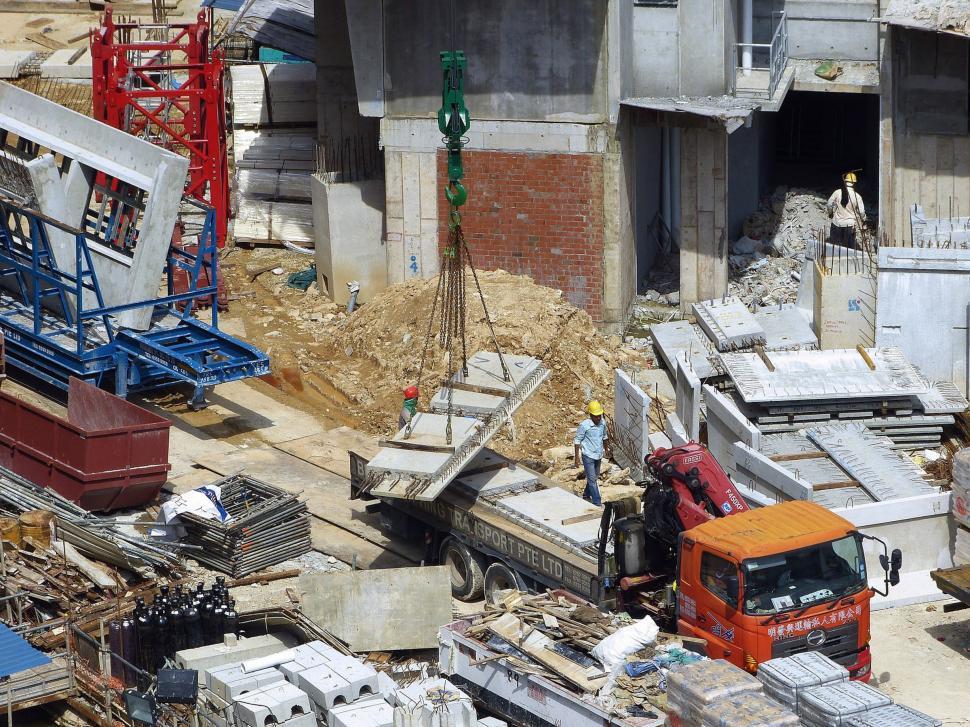 Free Image of Construction Site With Red Truck and Crane 