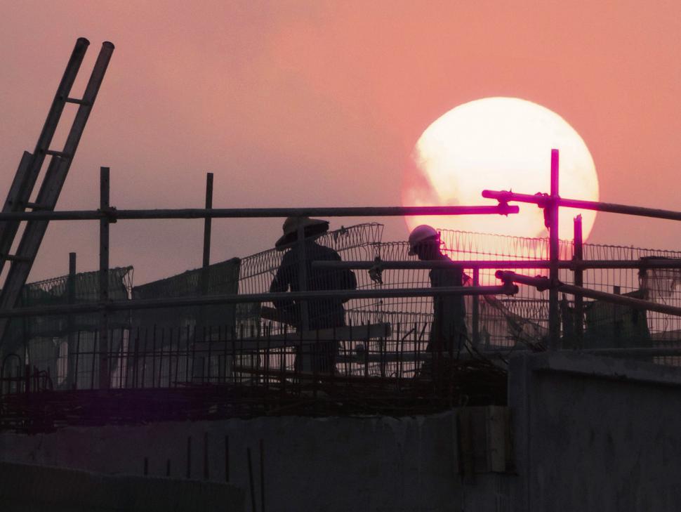 Free Image of Couple Standing on Top of Bridge 