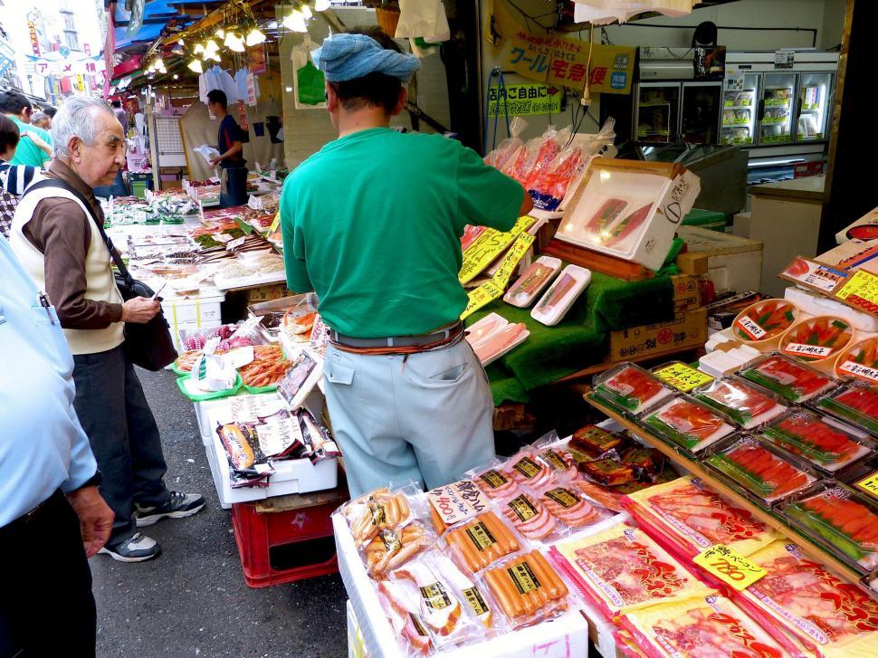 Free Image of People Standing Around Market 