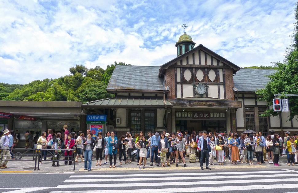 Free Image of Group of People Standing in Front of Building 