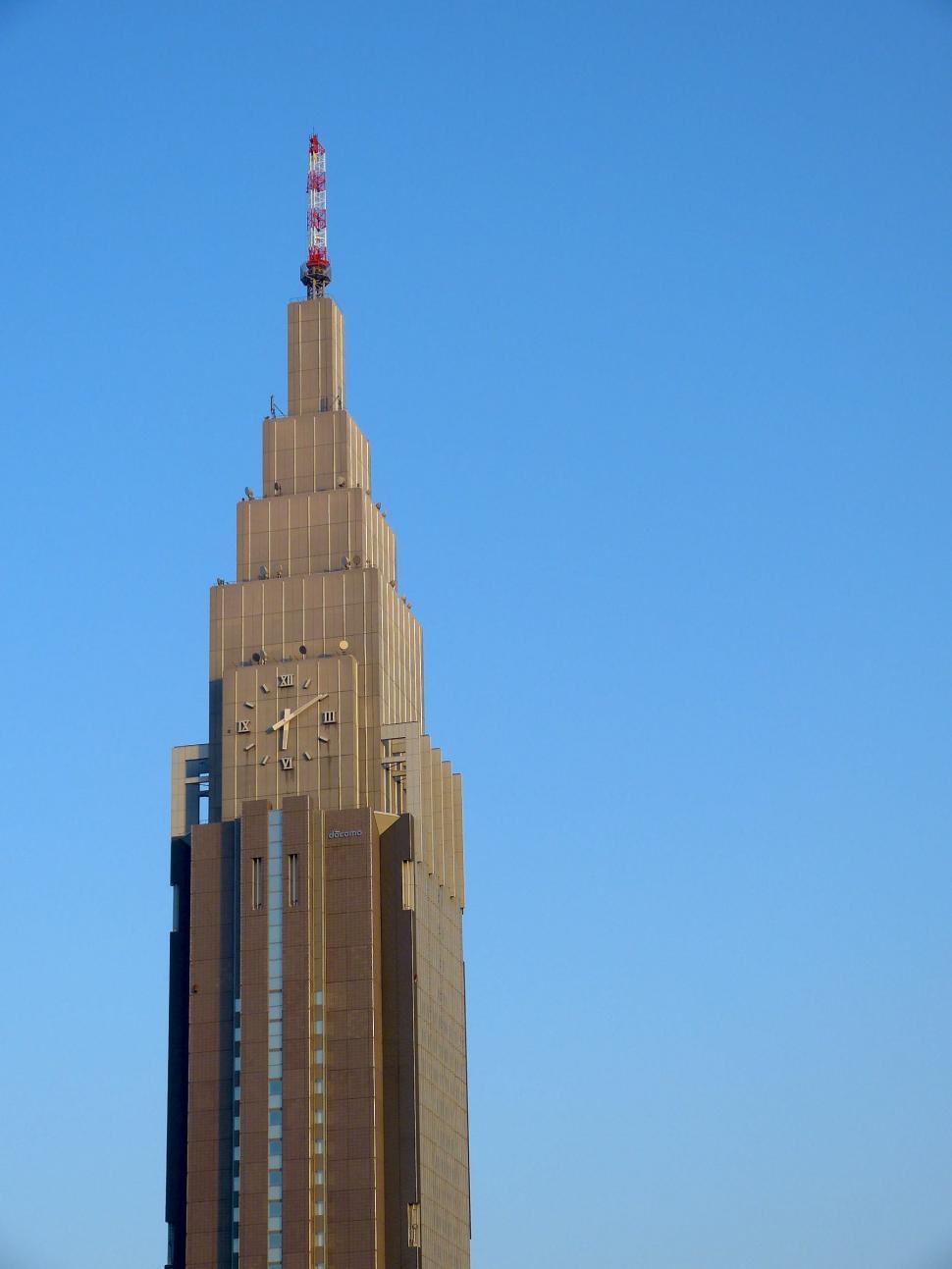 Free Image of Towering Building With Clock on Side 