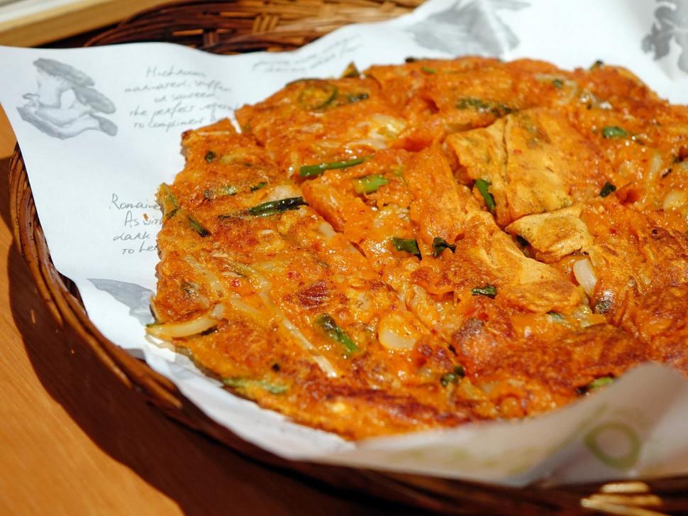 Free Image of Basket Filled With Food on Wooden Table 