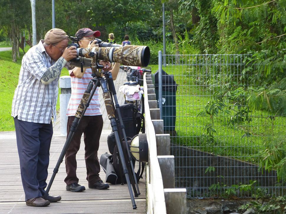 Free Image of Man Taking Picture of Another Man With Camera 