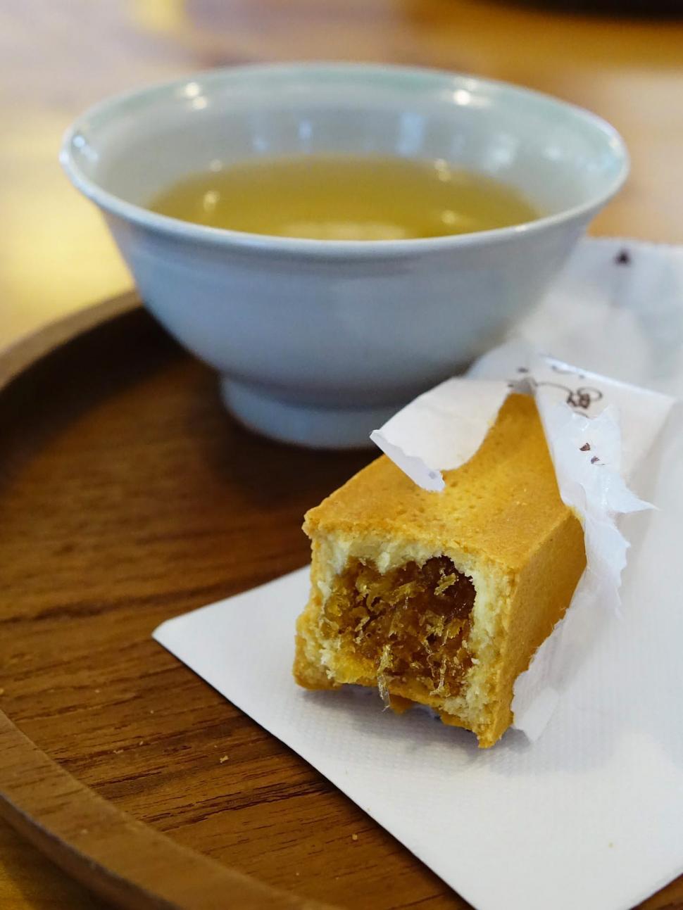Free Image of A Bowl of Soup and a Piece of Cake on a Plate 