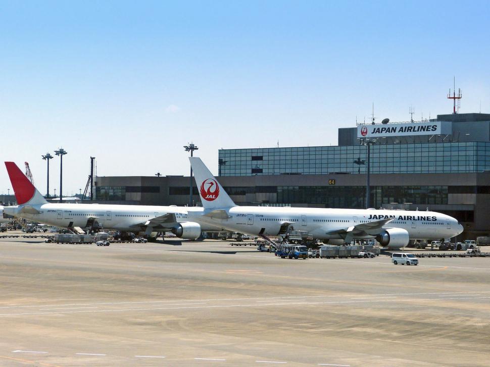 Free Image of Large Jetliner Parked on Airport Tarmac 