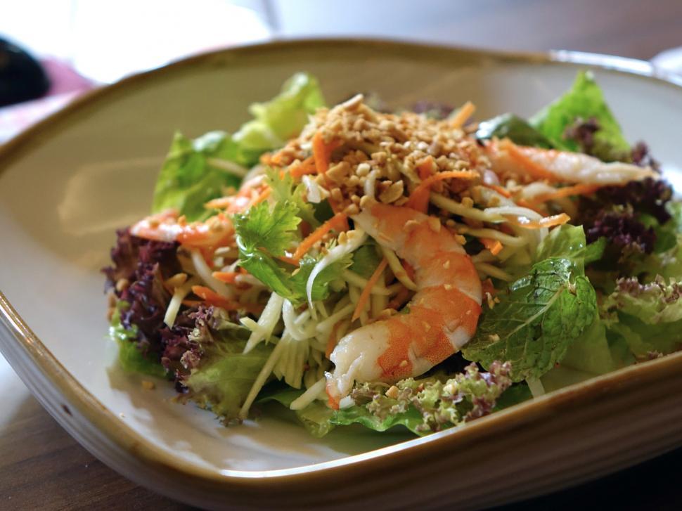 Free Image of White Plate Topped With Salad and Toppings 