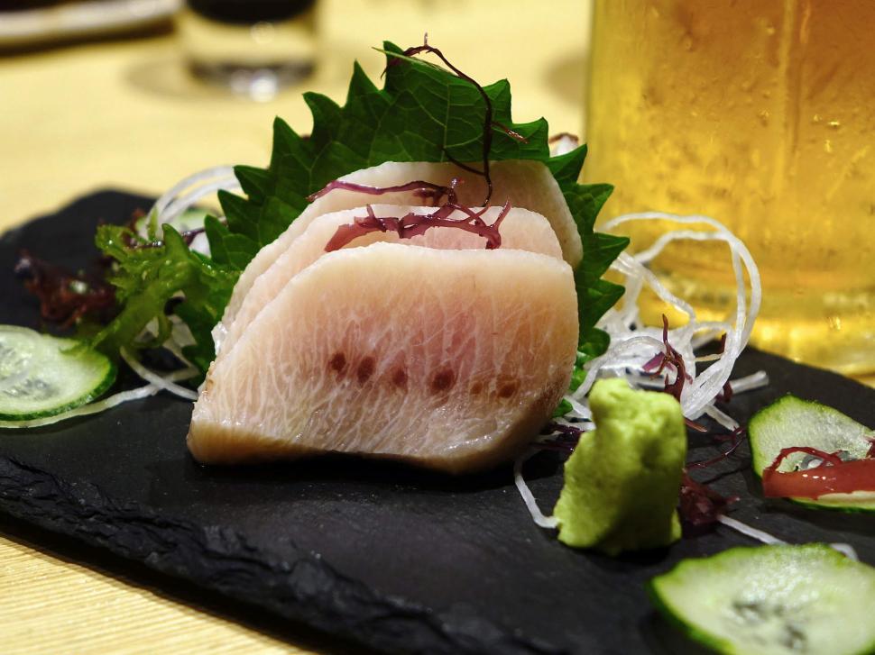 Free Image of Black Plate of Meat Slices Next to Glass of Beer 