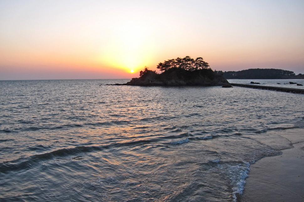 Free Image of Small Island in the Middle of Body of Water 