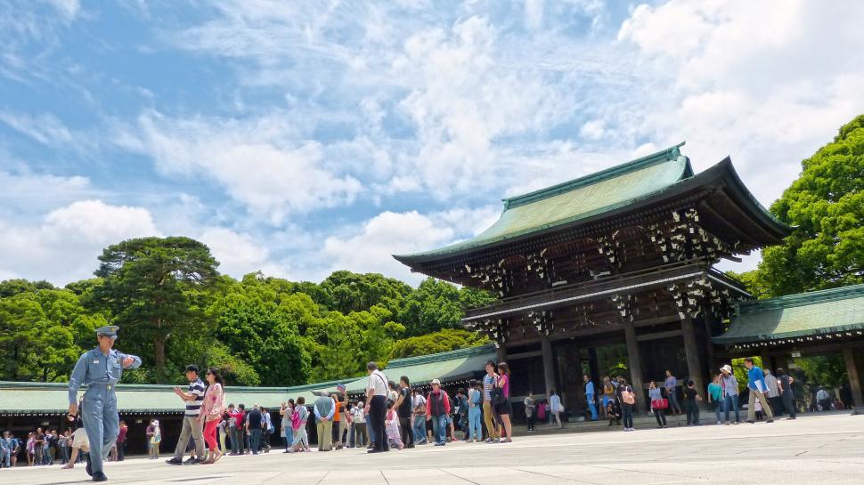 Free Image of Large Group of People Standing in Front of Building 