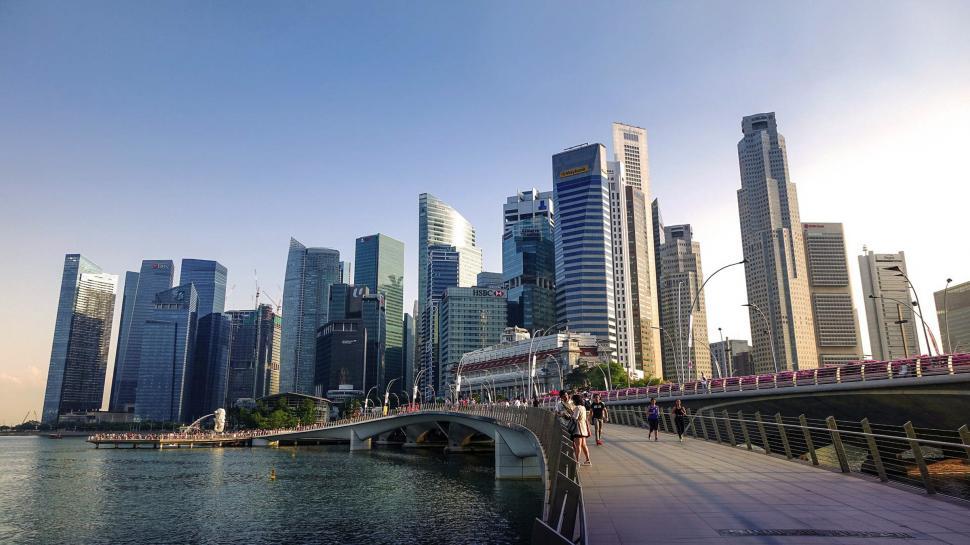 Free Image of City Skyline With Bridge Over Body of Water 
