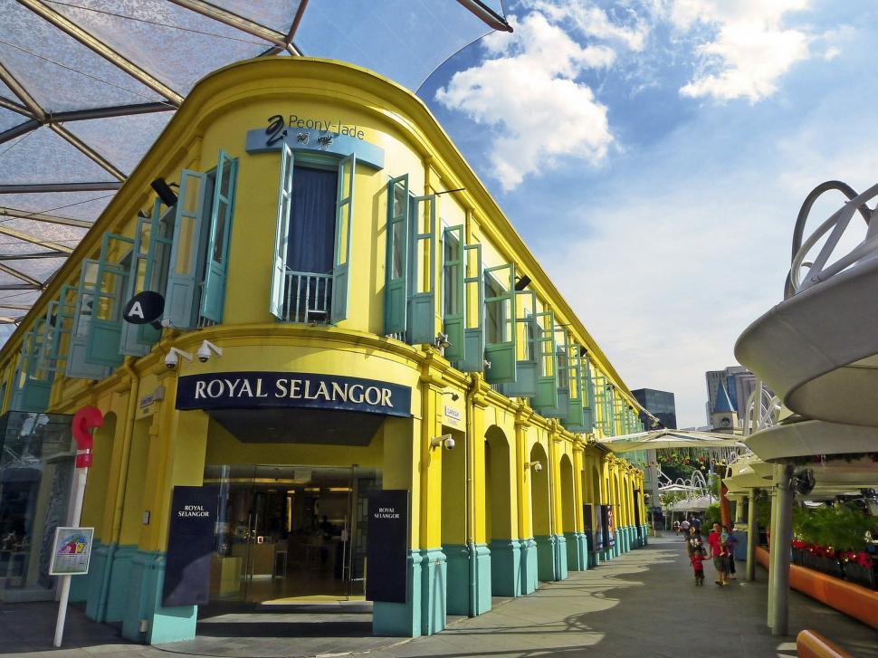 Free Image of Yellow Building With Blue Shutters 