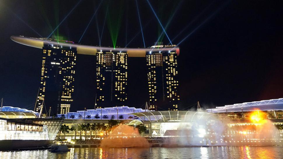 Free Image of Tall Building Covered in Bright Lights 