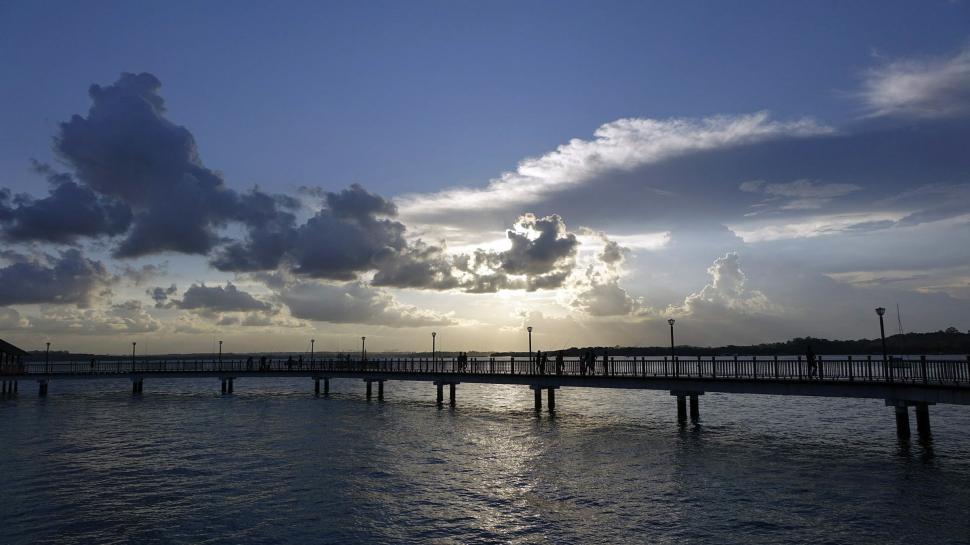Free Image of Sunset Over Water and Bridge 