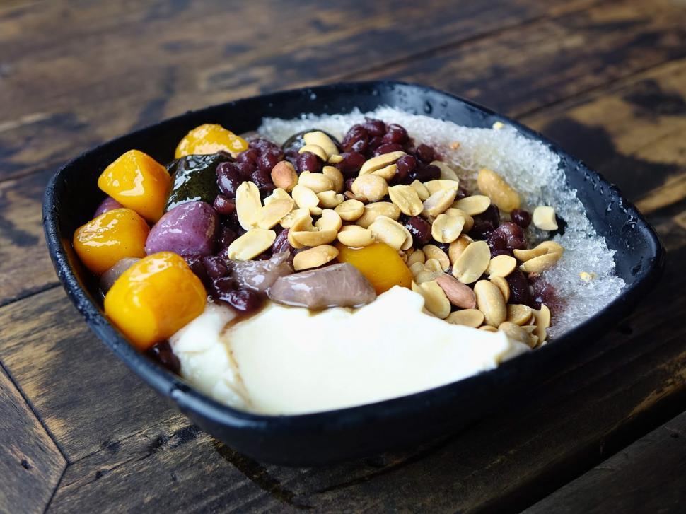 Free Image of Bowl of Fruit and Nuts on Wooden Table 