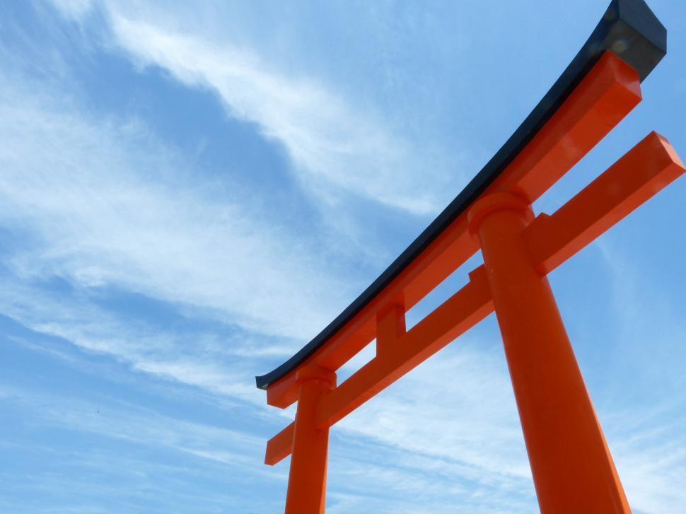 Free Image of Tall Orange Structure Against Sky 