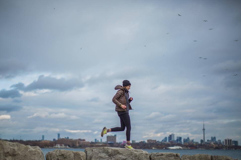 Free Image of Female Athlete Tying Her Shoes 
