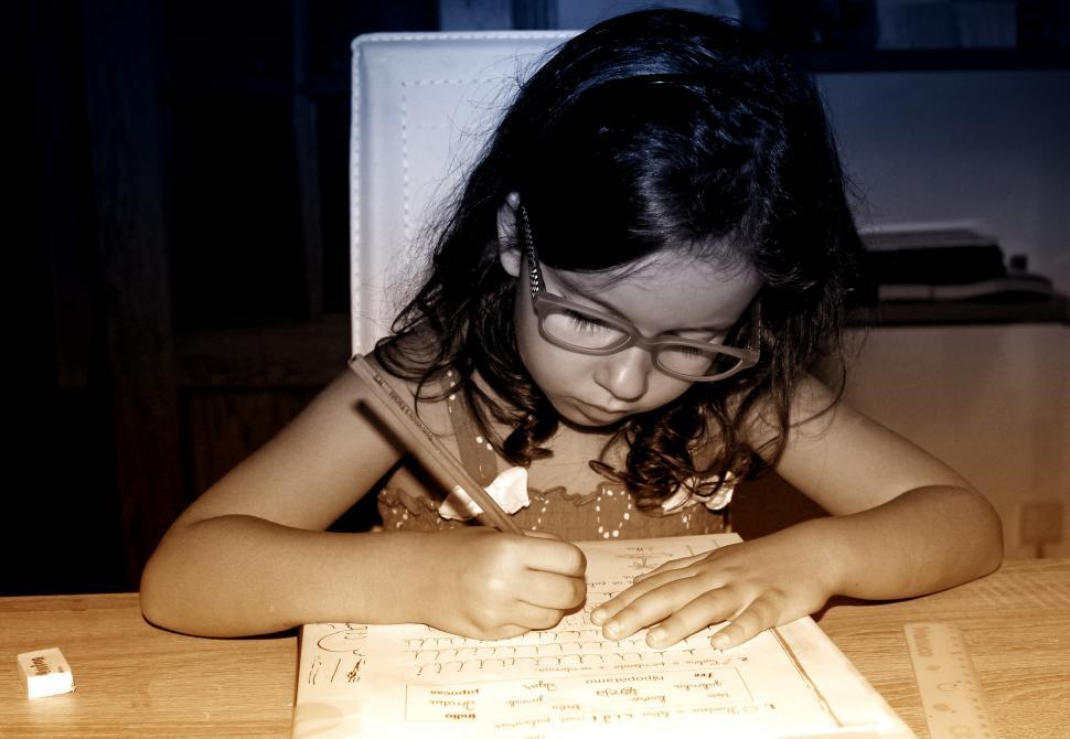 Free Image of Little Girl Doing Homework 