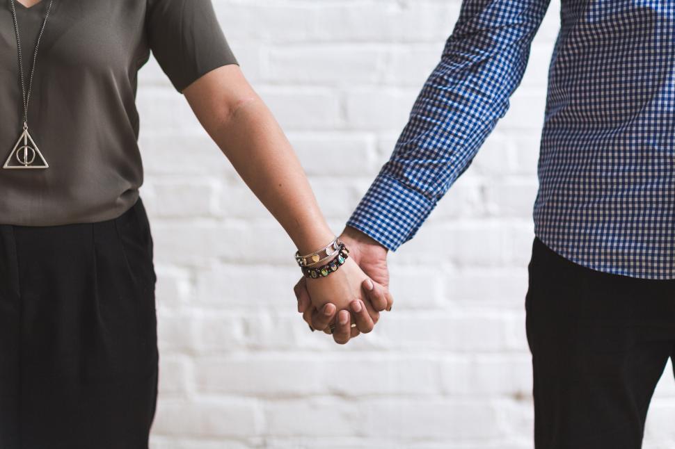 Free Image of Man Woman Holding Hands 