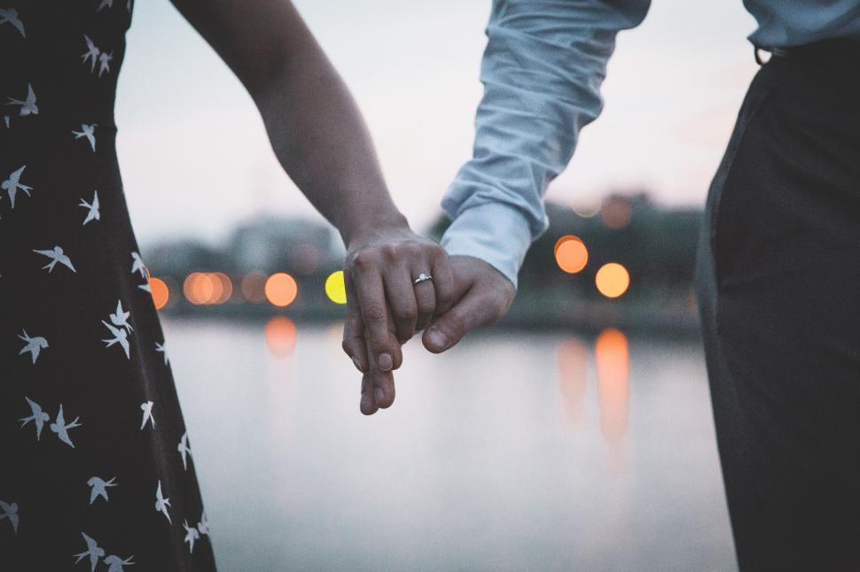 Free Image of Married Couple Holding Hands 