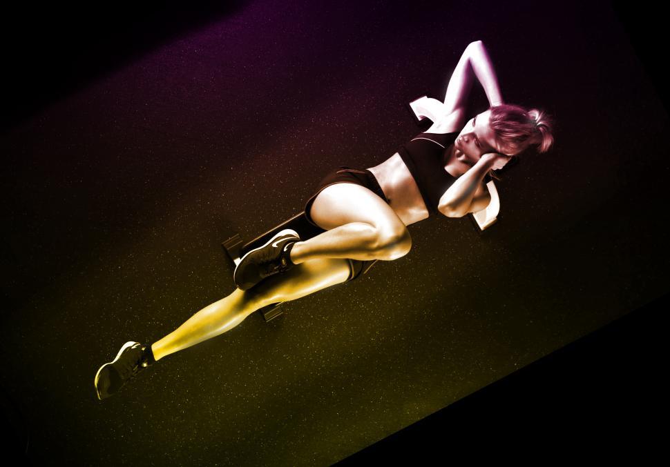 Free Image of Woman Exercising Abs on the Floor Mat 