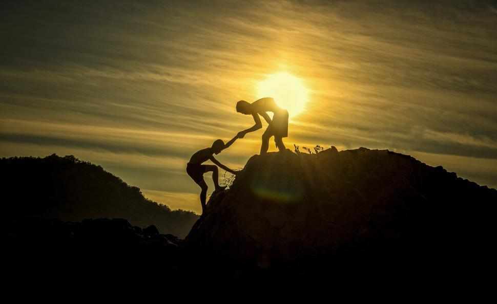 Free Image of Couple Standing on Mountain Top 