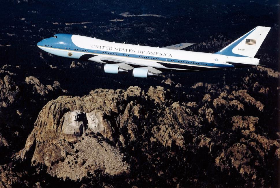 Free Image of Jetliner Flying Over Rocky Mountain 