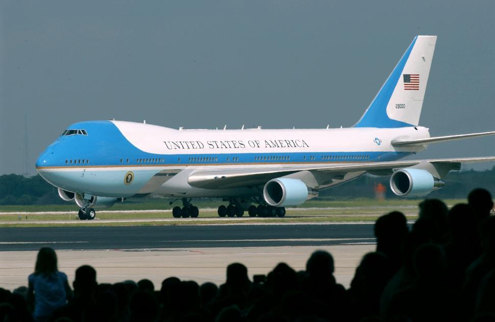 Free Image of Large Blue and White Jetliner on Airport Runway 