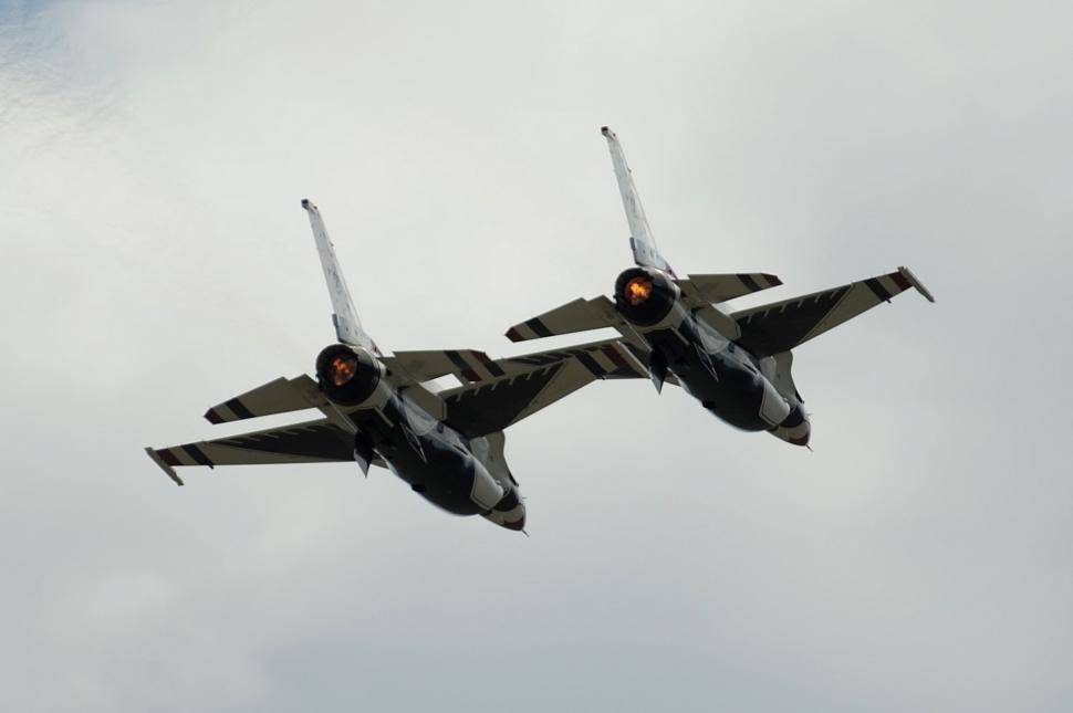 Free Image of Fighter Jets Flying Through Cloudy Sky 