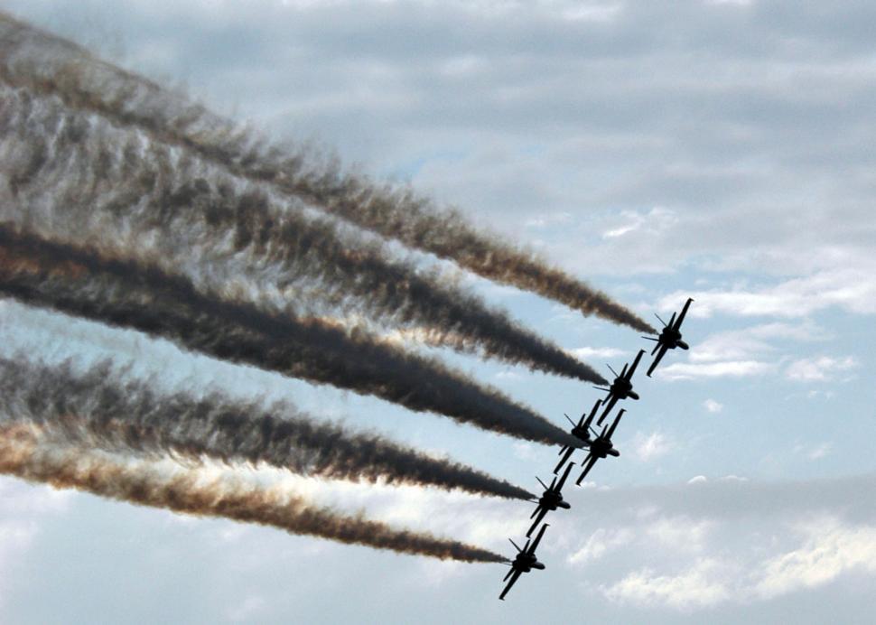Free Image of Group of Jets Flying Through Cloudy Sky 