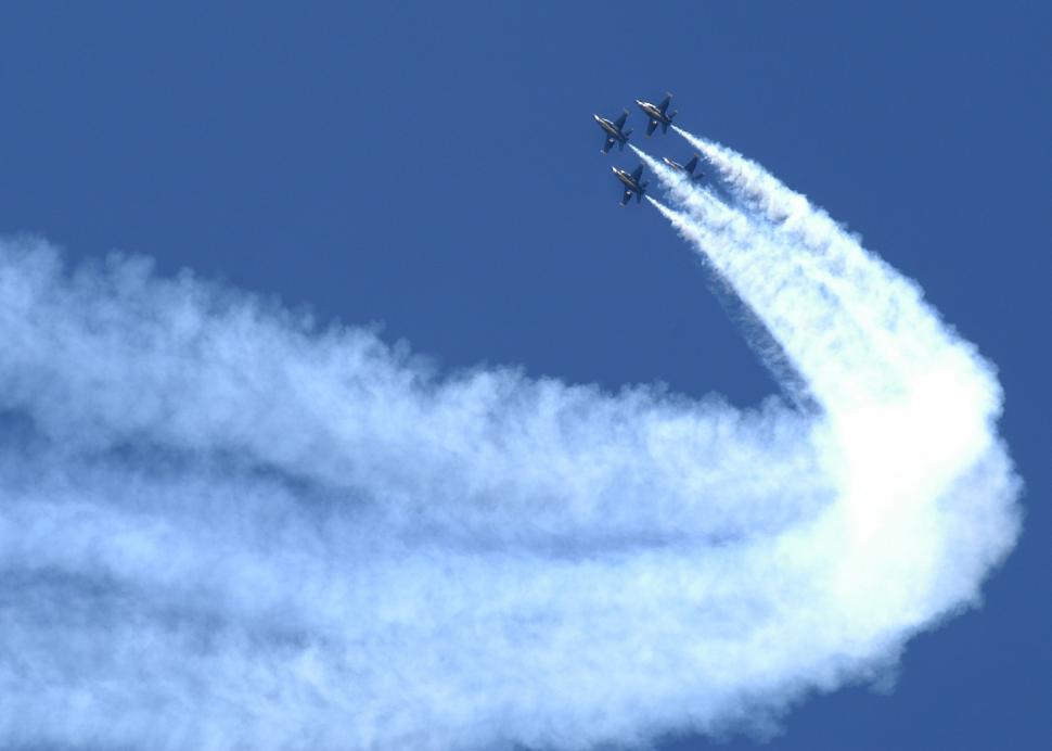Free Image of Two Jets Flying With Trails of Smoke 