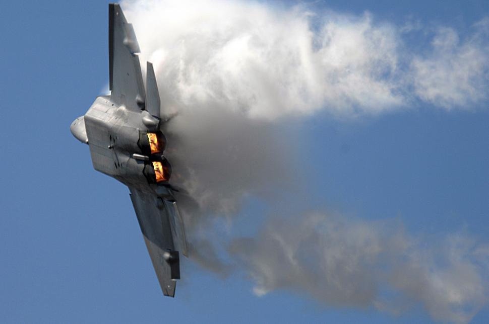 Free Image of Fighter Jet Flying Through Blue Sky 