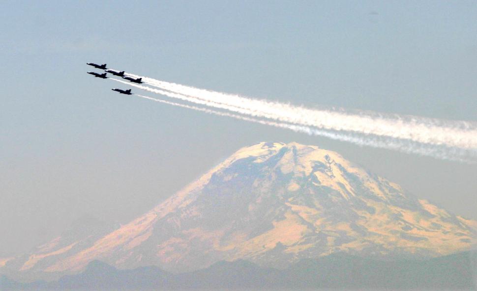 Free Image of Fighter Jets Flying Over Snow Covered Mountain 