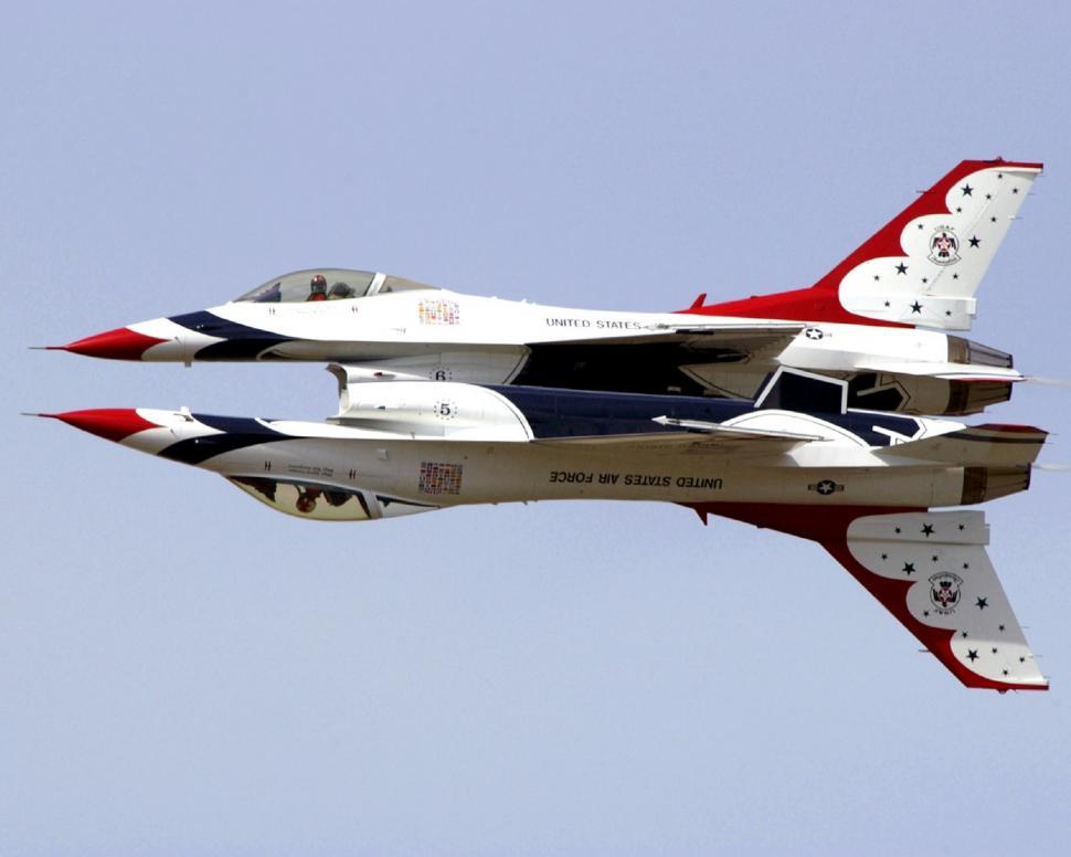Free Image of Fighter Jets Flying Through Blue Sky 