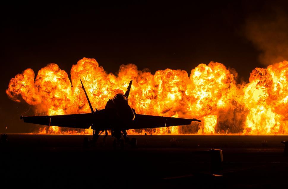 Free Image of Fighter Jet Parked on Airport Runway 