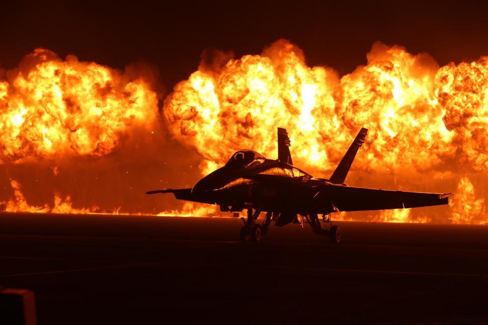 Free Image of Fighter Jet Parked on Airport Runway 