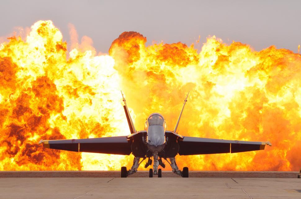Free Image of Fighter Jet Parked on Airport Runway 