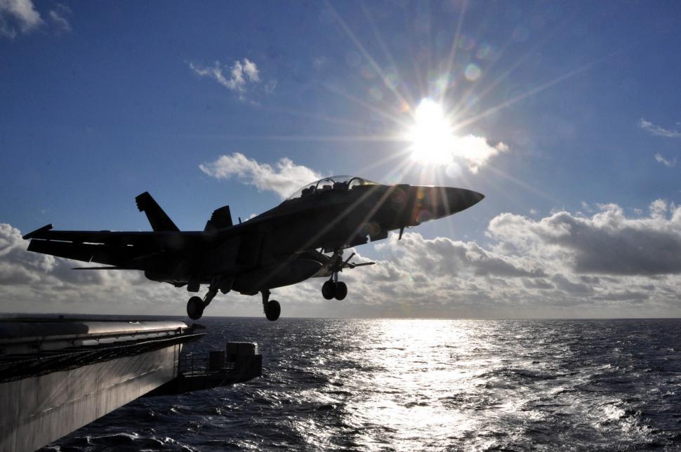 Free Image of Fighter Jet Flying Over a Body of Water 