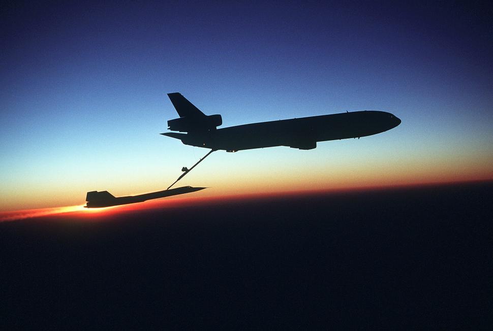 Free Image of Plane Flying in the Sky at Sunset 