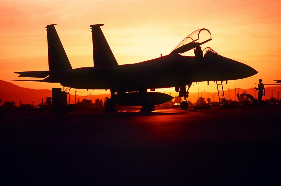 Free Image of Fighter Jet Parked on Airport Tarmac 
