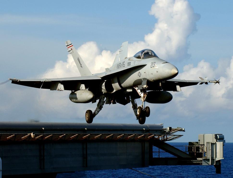 Free Image of Fighter Jet Taking Off From Aircraft Carrier 