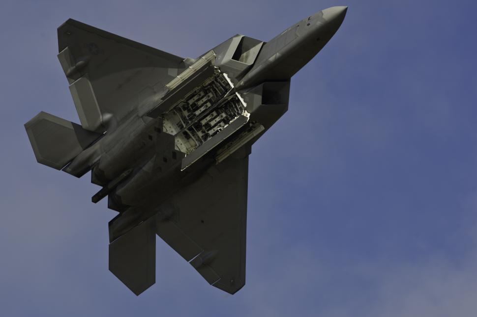 Free Image of Fighter Jet Flying Through Blue Sky 