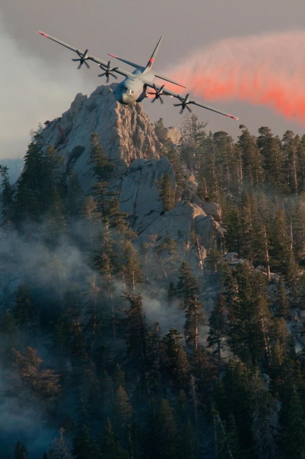 Free Image of Group of Planes Flying Over a Mountain 