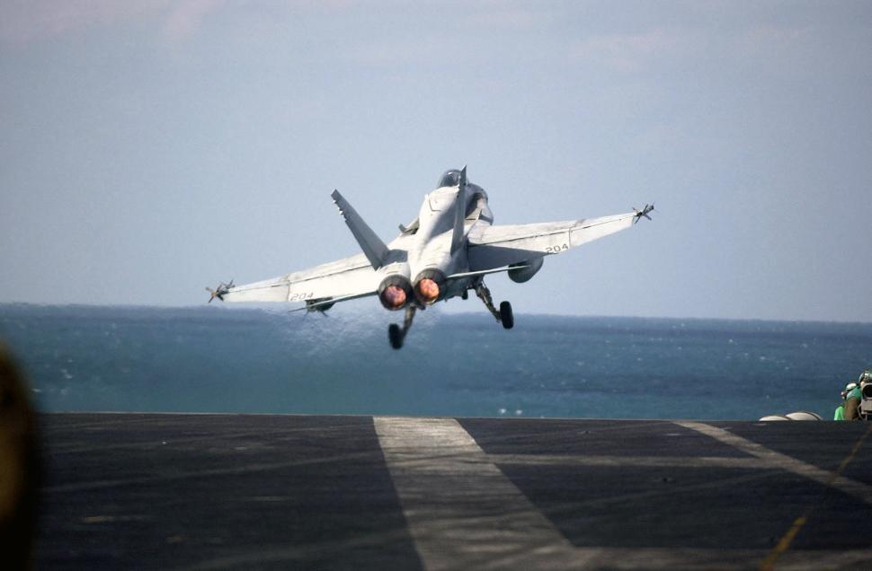 Free Image of Fighter Jet Taking Off From Aircraft Carrier 